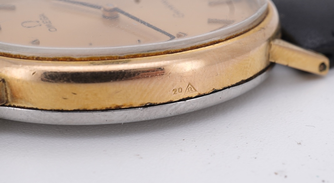 A lady's early 1970's steel and gold plated Omega manual wind wrist watch, with oval dial and baton numerals, case diameter 26mm, movement c.620, on an associated leather strap, with box no papers.